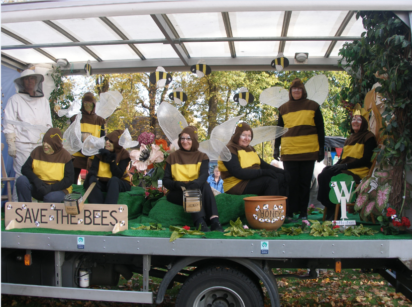 A group of women dressed in bee costumes