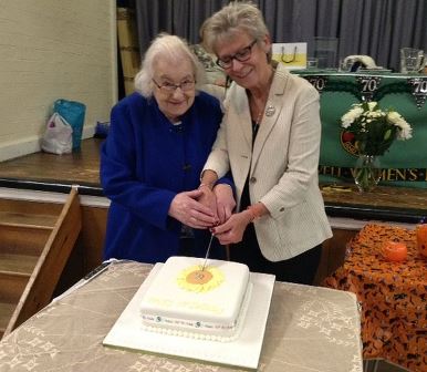 Phyllis & Diane cutting cake