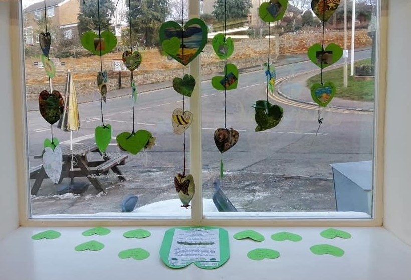 Shop window with green hearts display