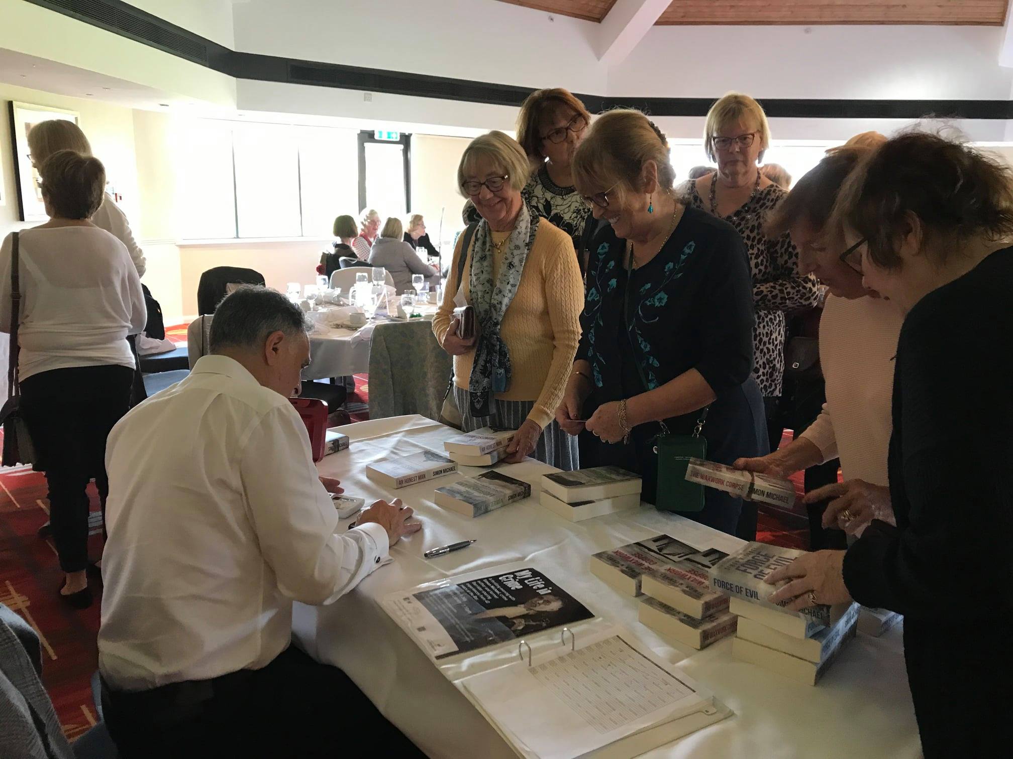 Simon Michael signing books Signing books