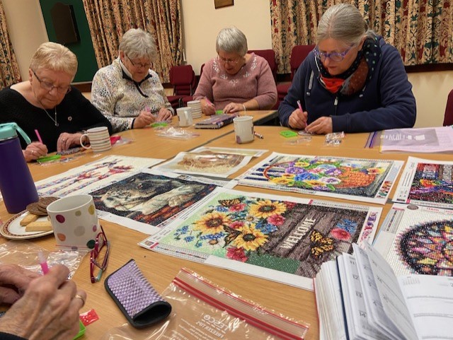 23.11 Group concentrating on beading