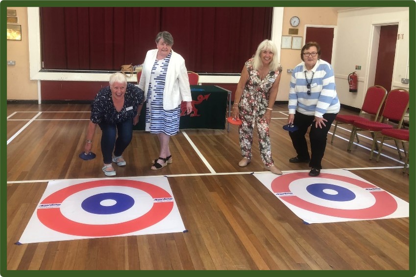 Rhoose WI with 4 women playing curling