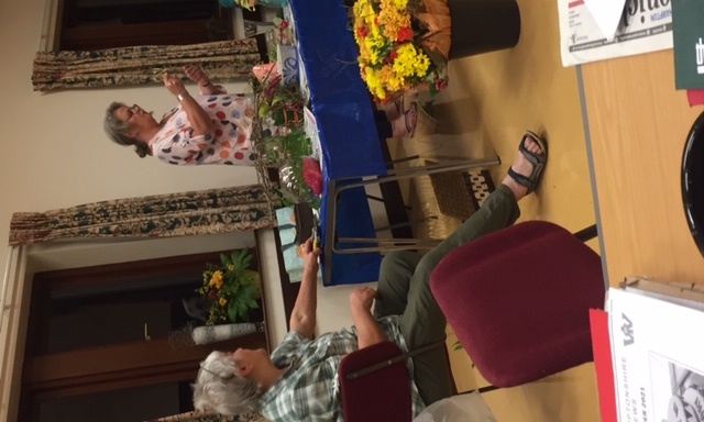 Paula demonstrating flowers, with Jane assisting Paula demonstrating flowers