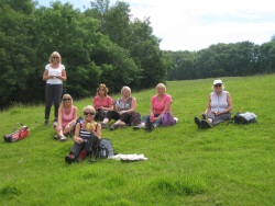 Walkers resting on their Cotswold Way walk