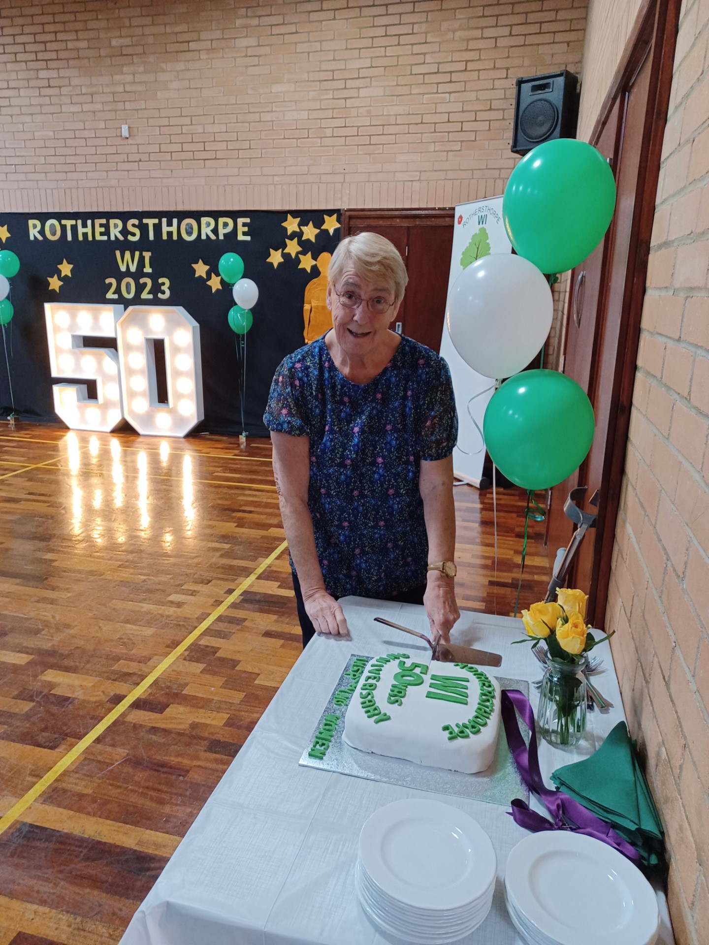 24.03 Founder member Barbara cutting cake