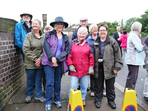 Members (and young friend) awaiting arrival of the torch