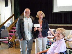 Patsy presenting cheque to Sandy of Portishead in Bloom
