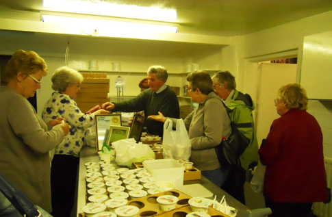 Members buying the finished yoghurt