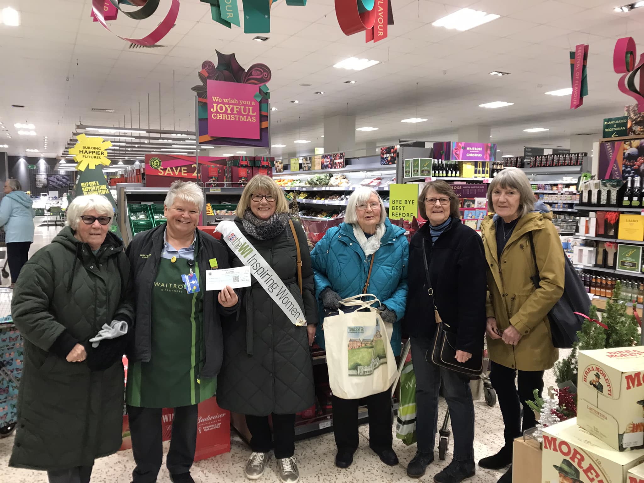 22.12  Towcester Evening WI members receiving a cheque from Waitrose